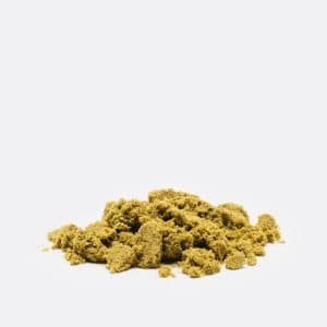 Hashberry Kief in a pile, Mustard Green Colored Powder.